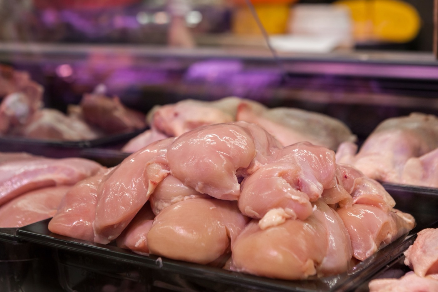 Chilled poultry portions stocked in a refrigerated display case